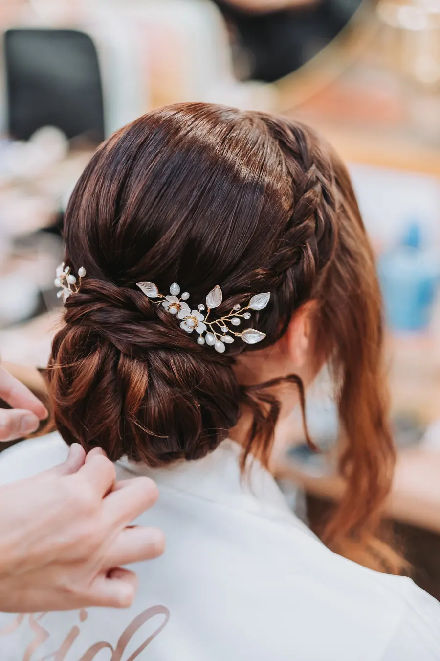 Pearl leaf pins arranged across the back of Evie-Mae's dark hair