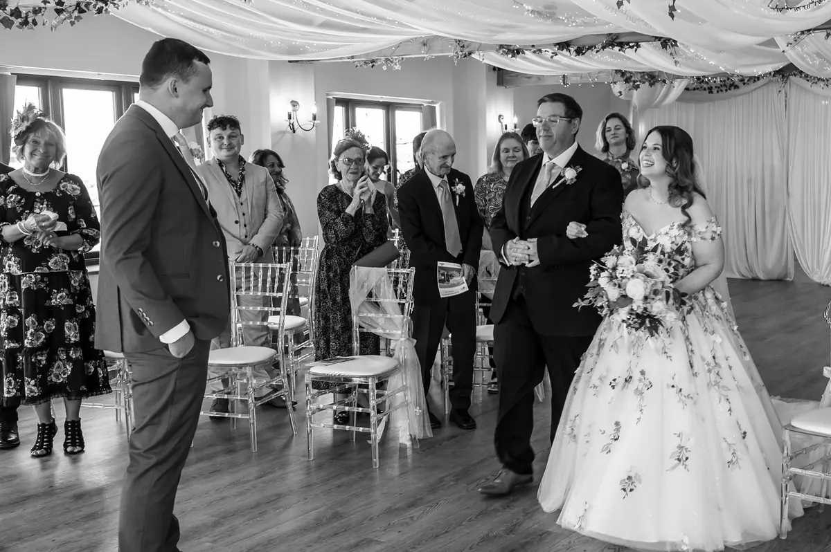 Megan and Dan facing each other during their Hall ceremony