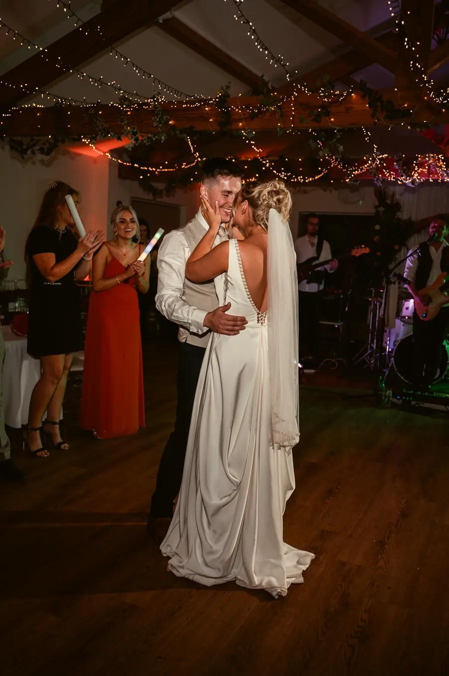 Olivia and Granville dancing together beneath the Hall ceiling lights