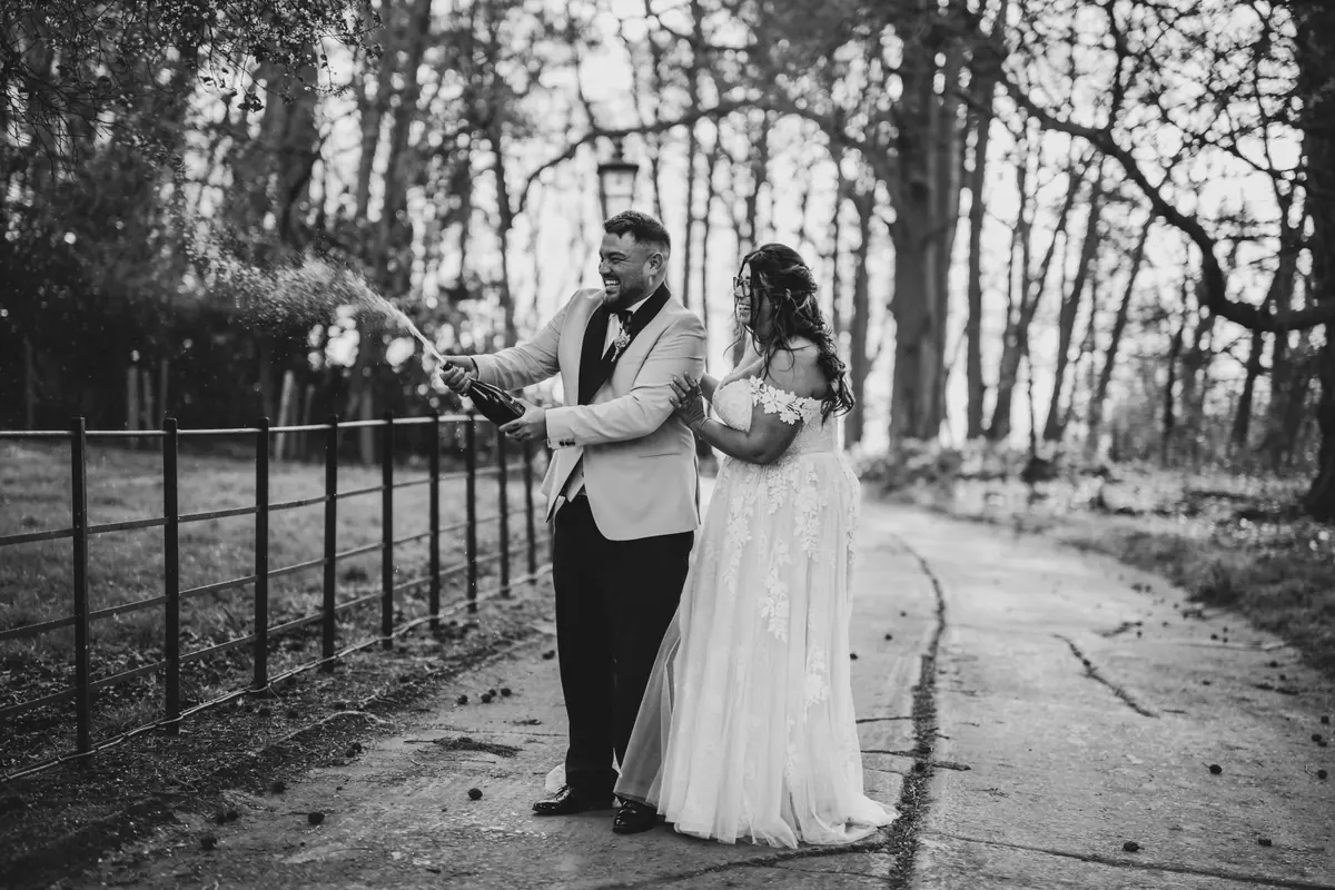 The couple standing on the lane in a black and white view