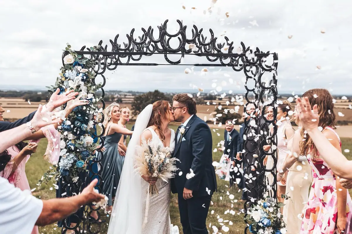 Newlyweds celebrating their outdoor ceremony at Thief Hall