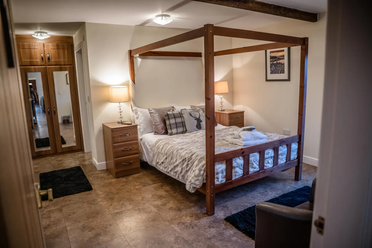 The timber four-poster bed in Swift Nick Cottage